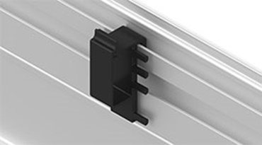 Clip para la sujeción de cables en los carriles de guiado